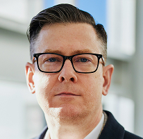 Alexander Hughes 最高経営責任者の肖像写真 暗号資産取引企業の経営幹部